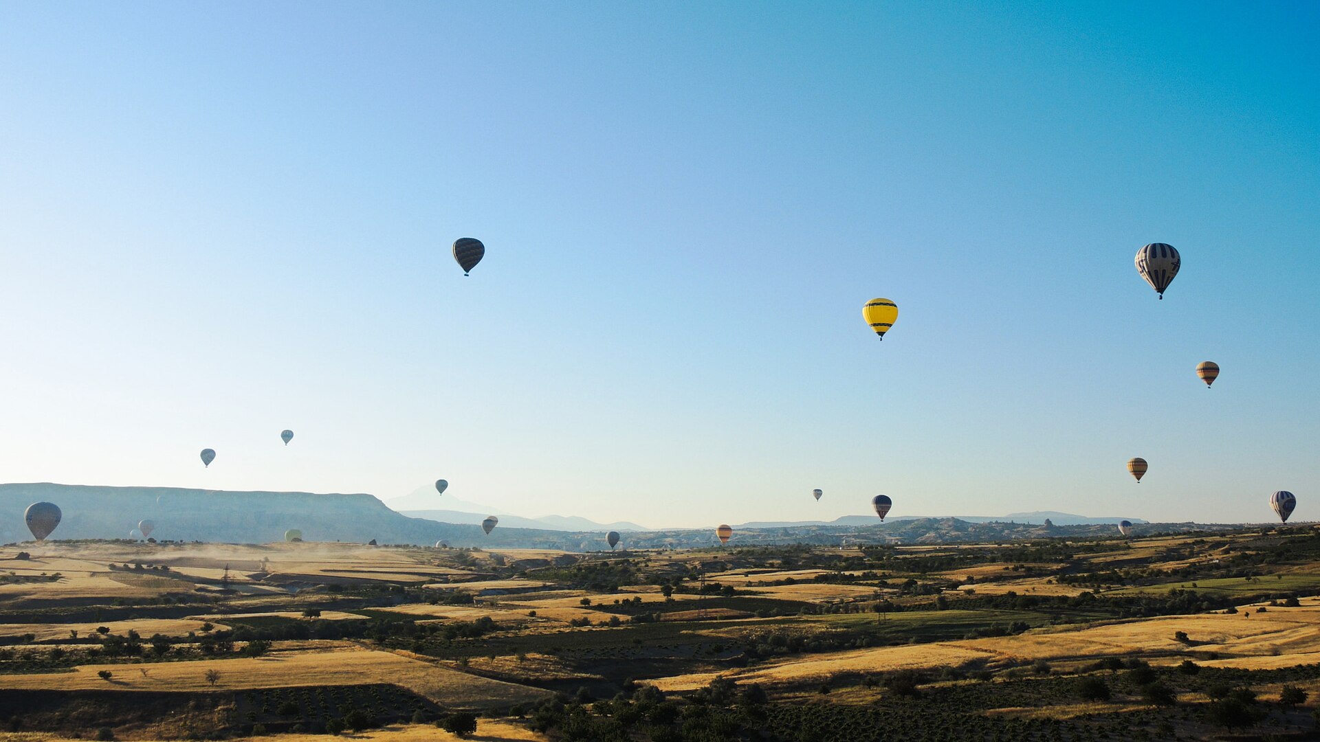 Hot-air balloons above Cappadocia's sculpted valleys