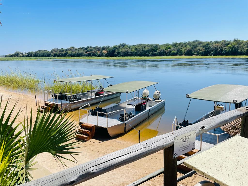 Calm water and green banks along the Kavango River