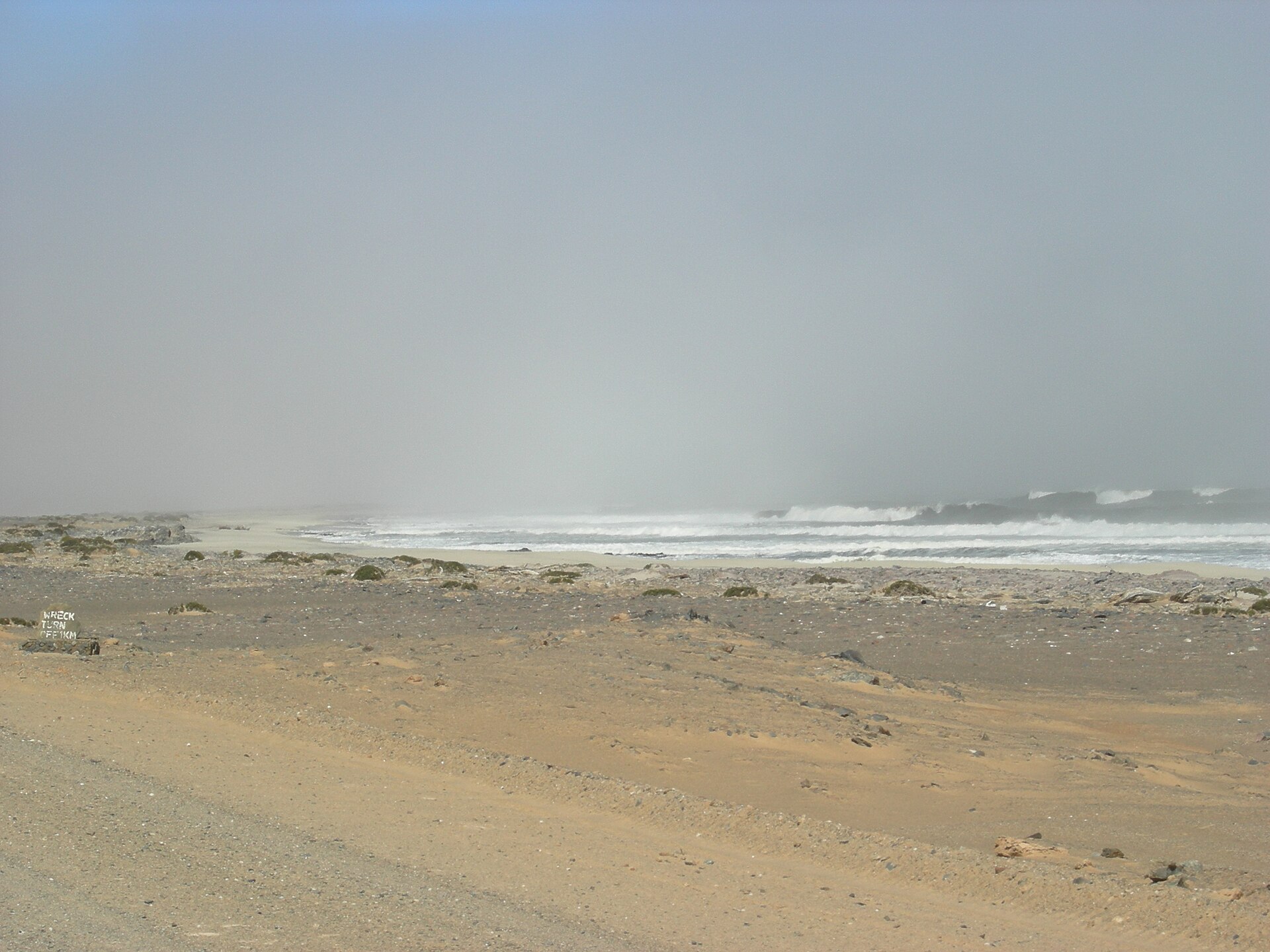 Atlantic shoreline and pale dunes of Namibia's Skeleton Coast