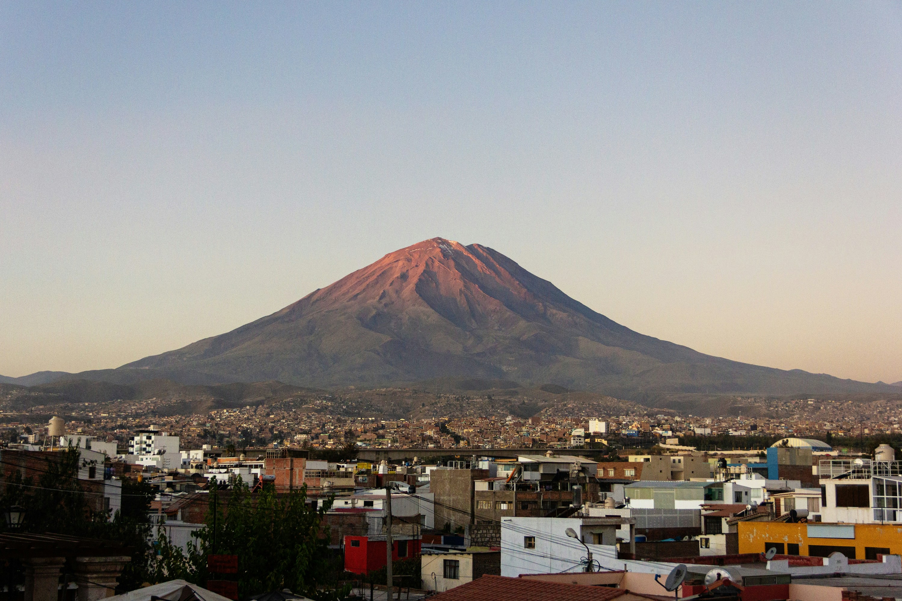 The city of Arequipa spread below El Misti volcano in evening light