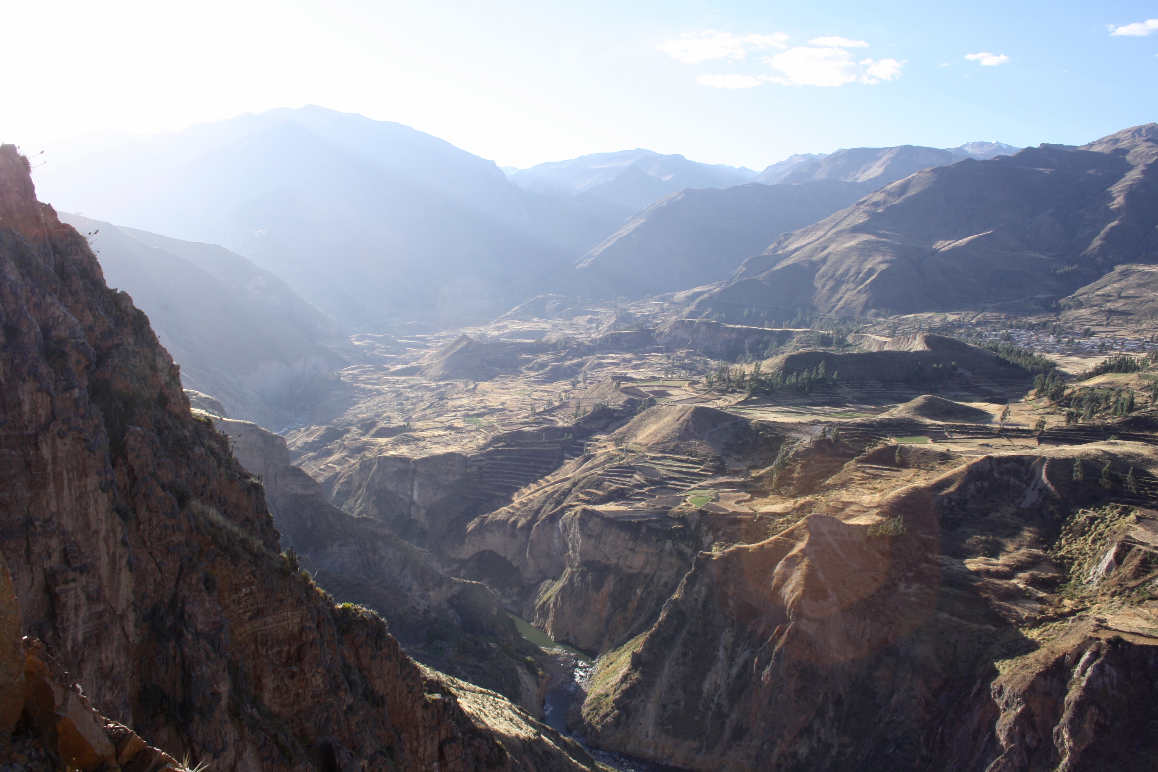 Morning light filling the deep terraces and mountain walls of Colca Canyon