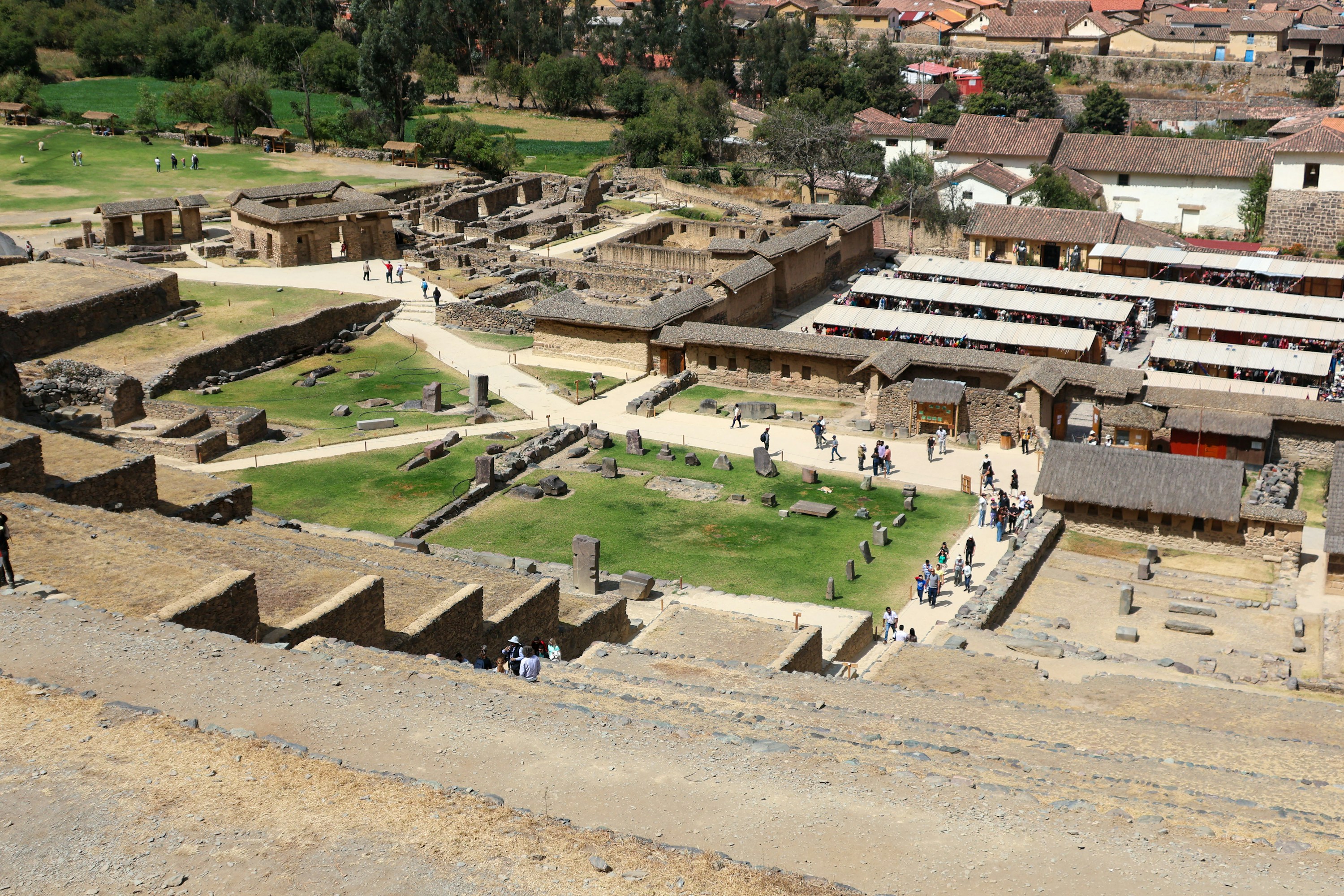 Ollantaytambo's Inca terraces, village and green fields viewed from above