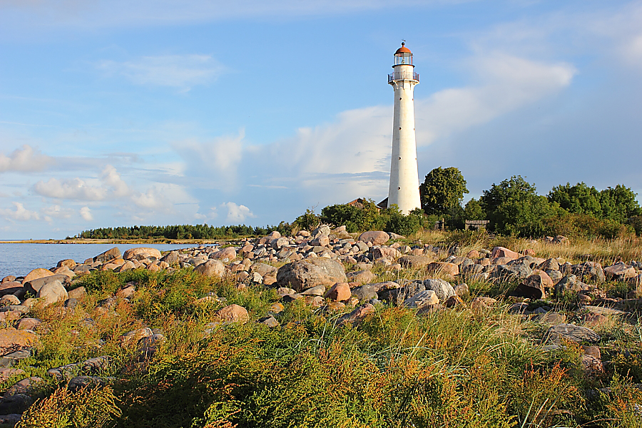 White cast-iron lighthouse with a red lantern on Kihnu island