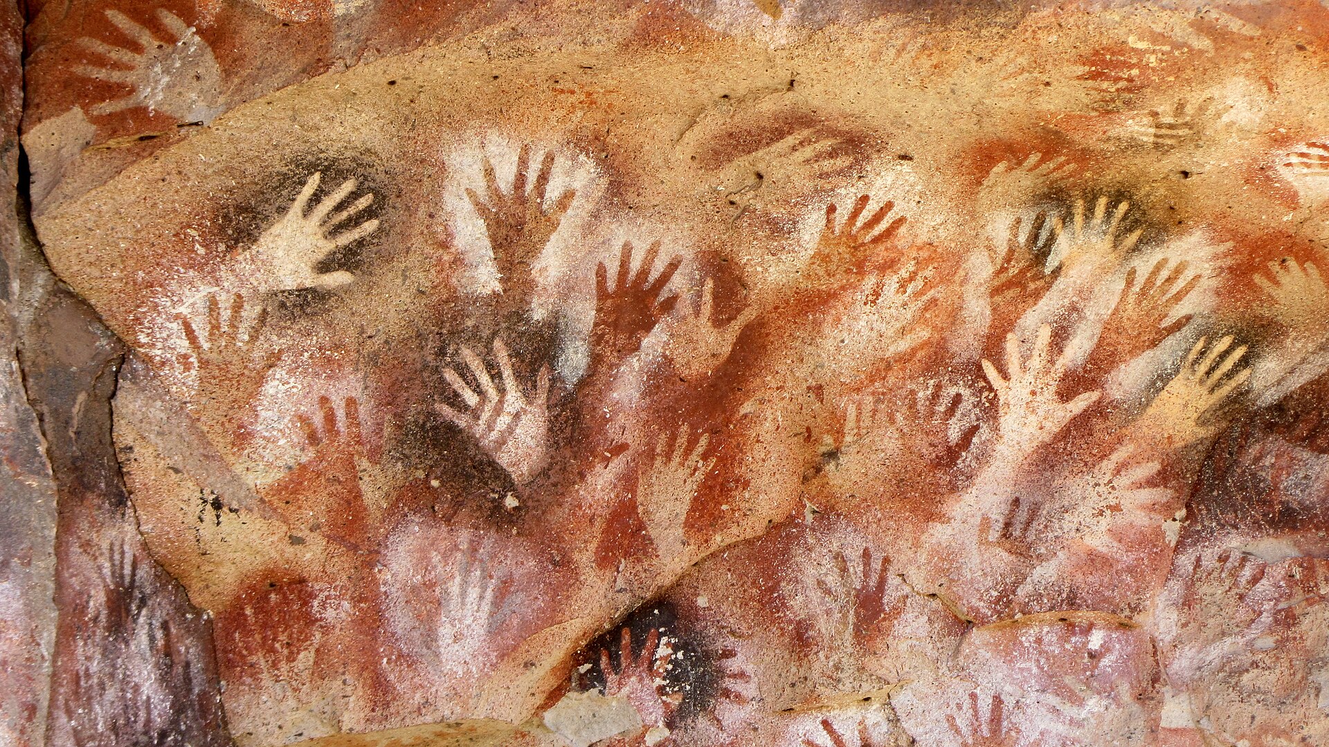 Hand stencils on the rock walls at Cueva de las Manos